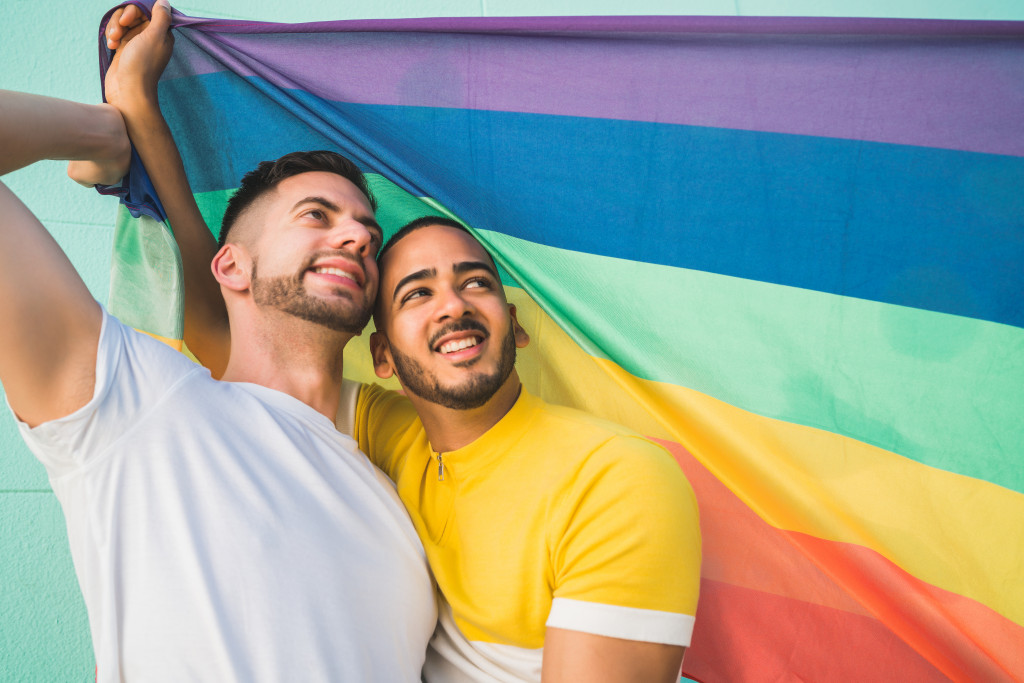 gay couple with a Pride flag
