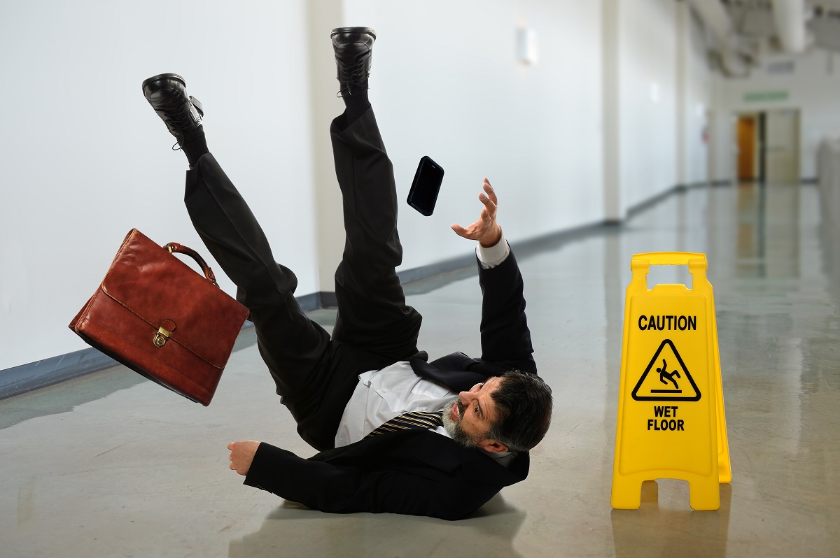 a businessman falling at the hallway